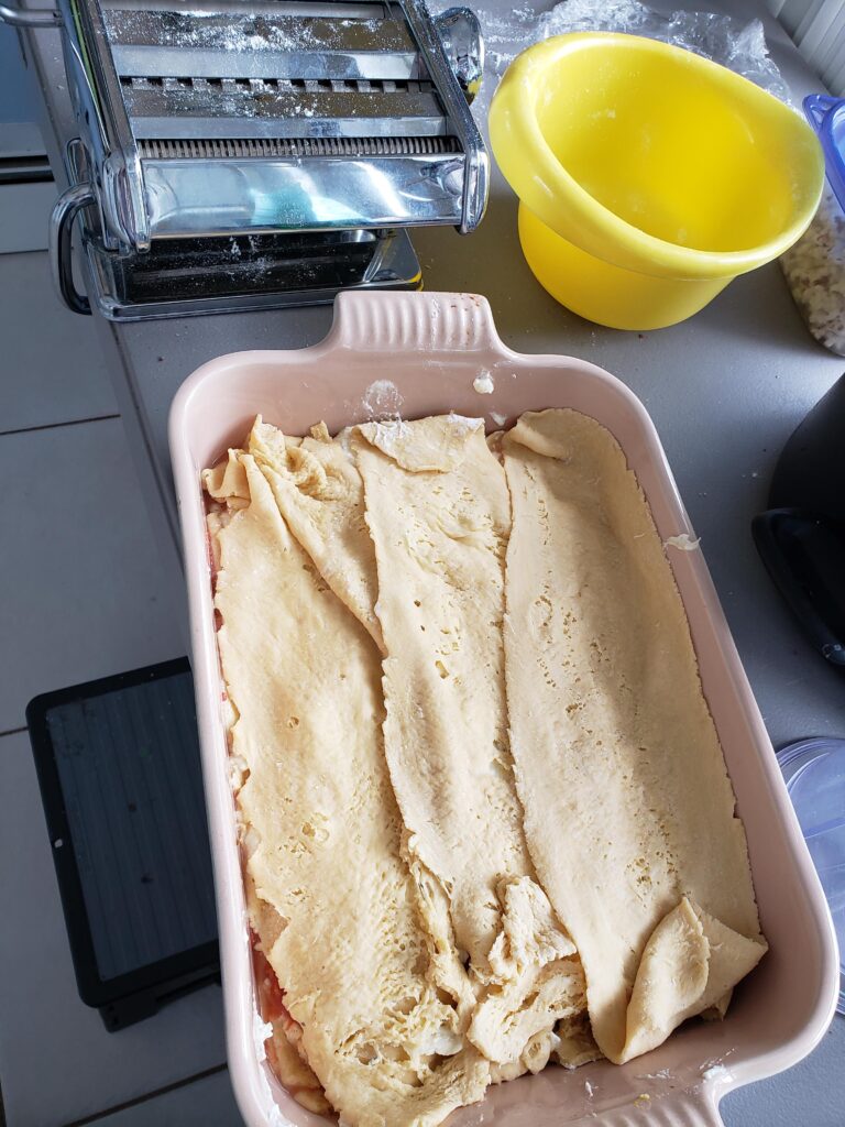 layering the homemade lasagna noodles