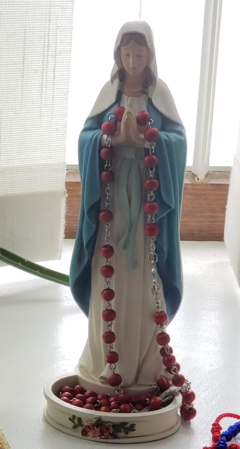 Our Lady statue holding a rosary